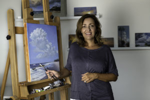 Margret McDermott with painting